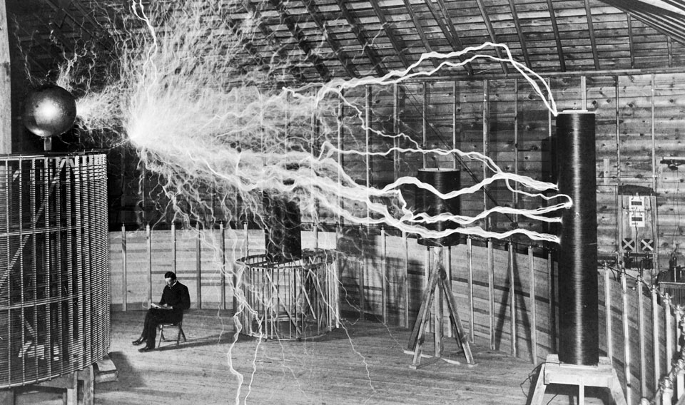 Nikola Tesla with his equipment