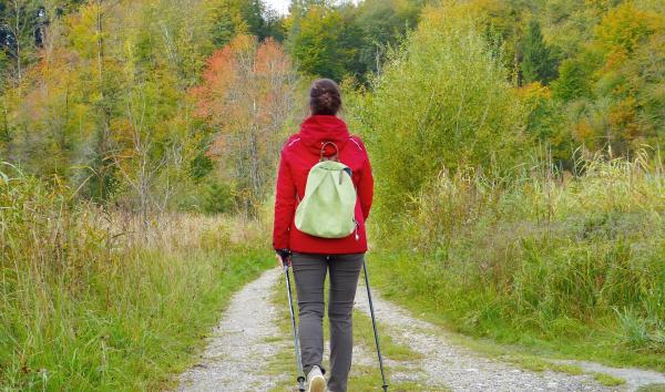 Woman walks along a path