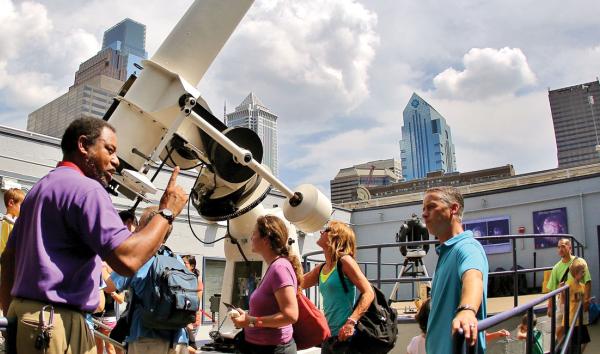 Crowds of Franklin Institute members gather on the roof in the Holt and Miller Observatory to do some Sun gazing.