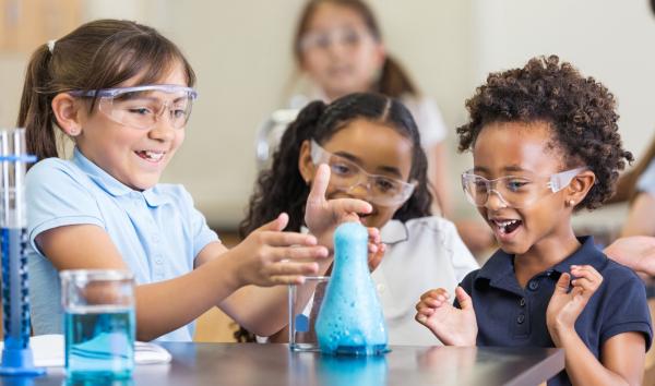 Interactive science: kids doing science in a classroom lab