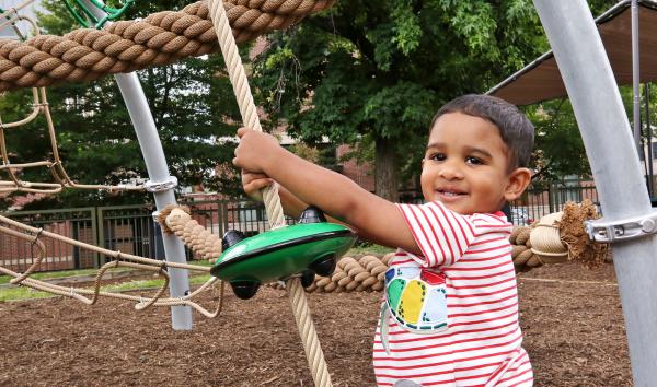 a smiling child in science park