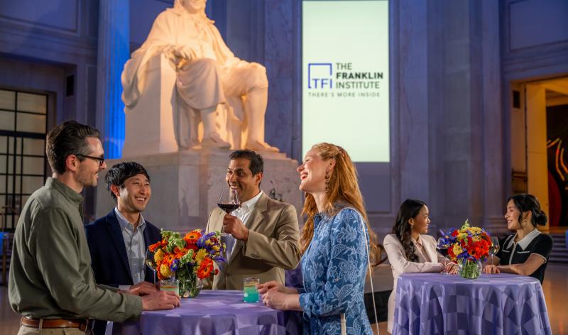 Group of adults gathered in Benjamin Franklin rotunda