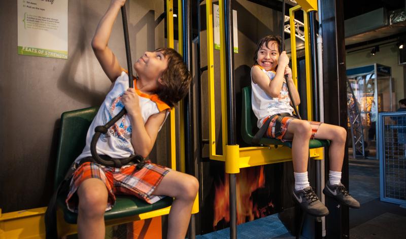 Kids pulling on pulleys