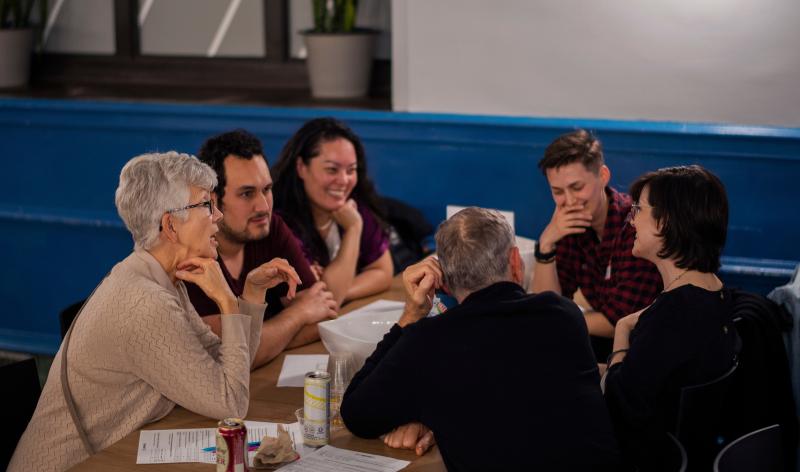 Group of adults around table