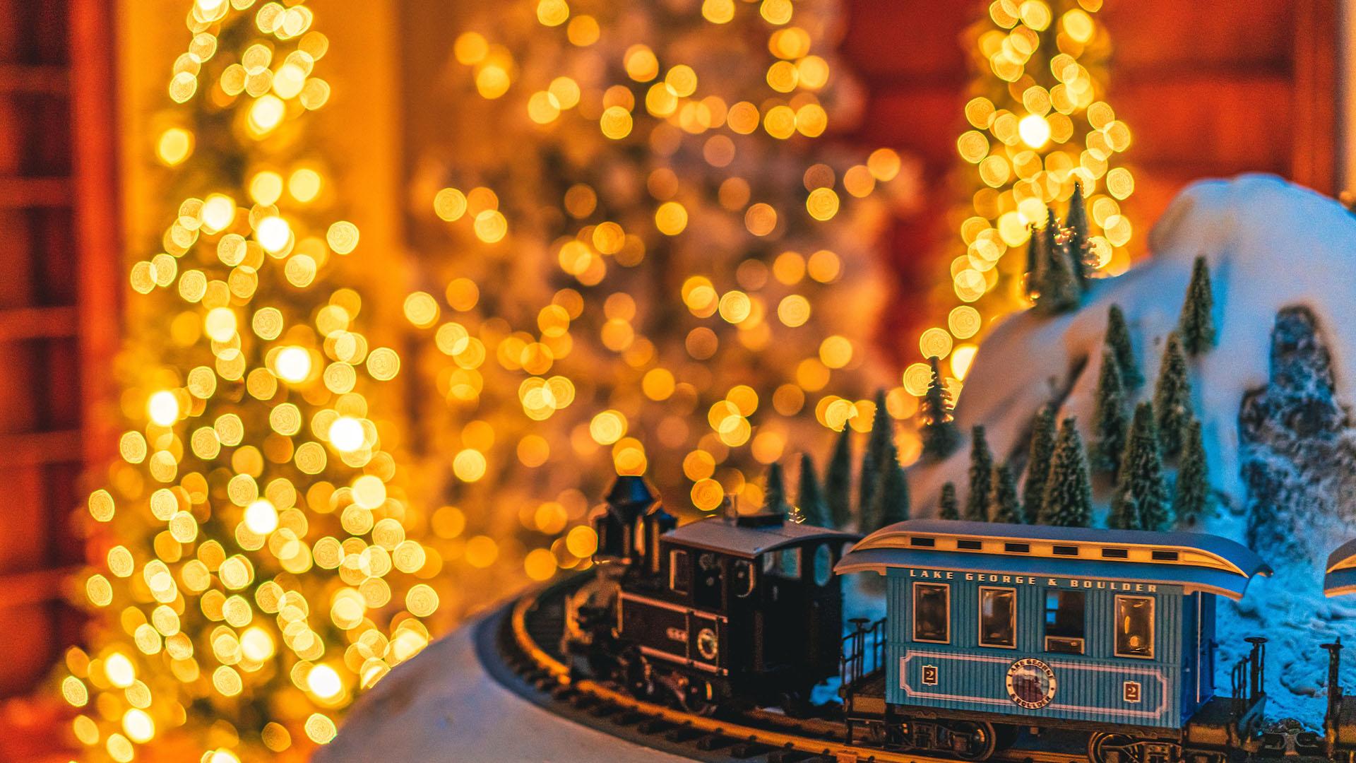 A model train and lighted trees at Franklin Frost.