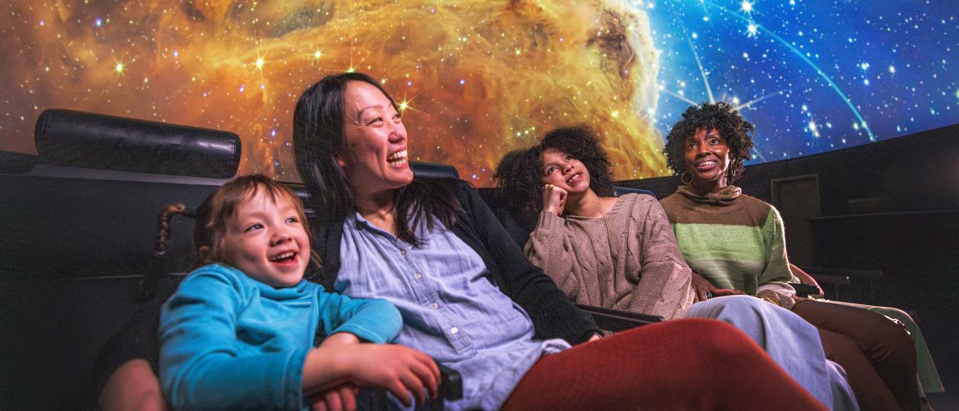 Group enjoying a planetarium show