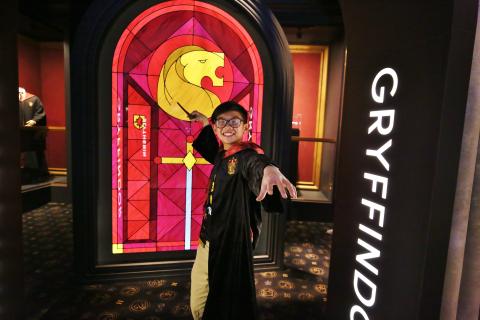 boy wearing Gryffindor costume