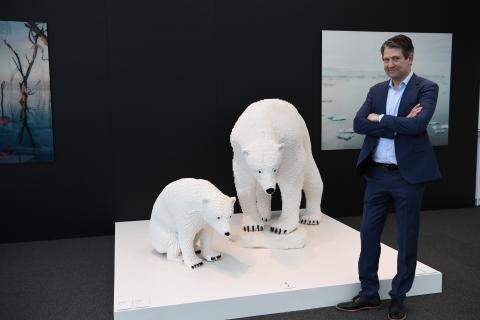 Artist with polar bear sculptures