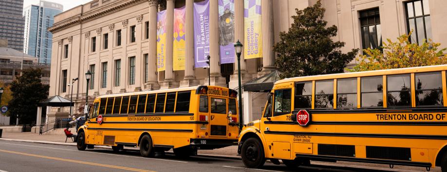 Exterior of The Franklin Institute with school buses