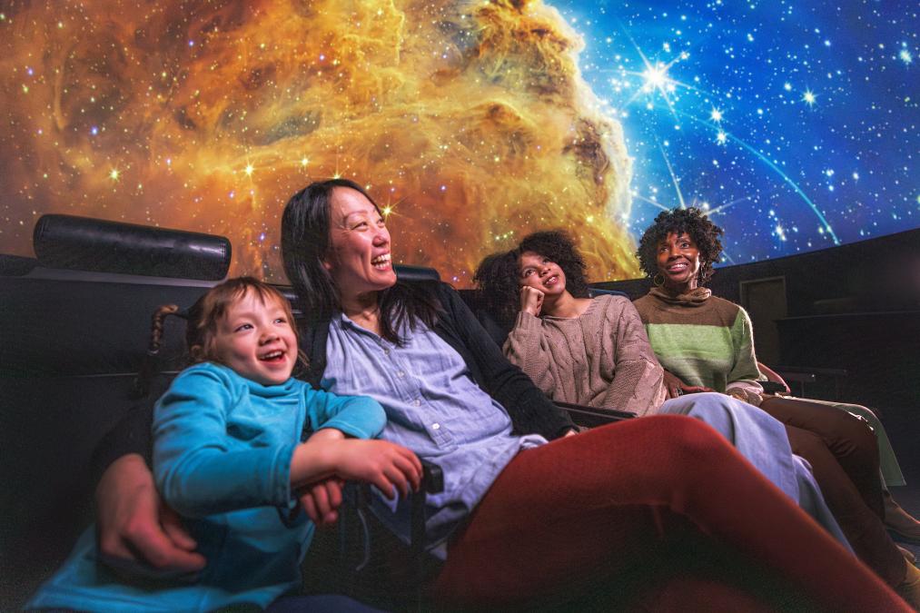 Group enjoying a planetarium show