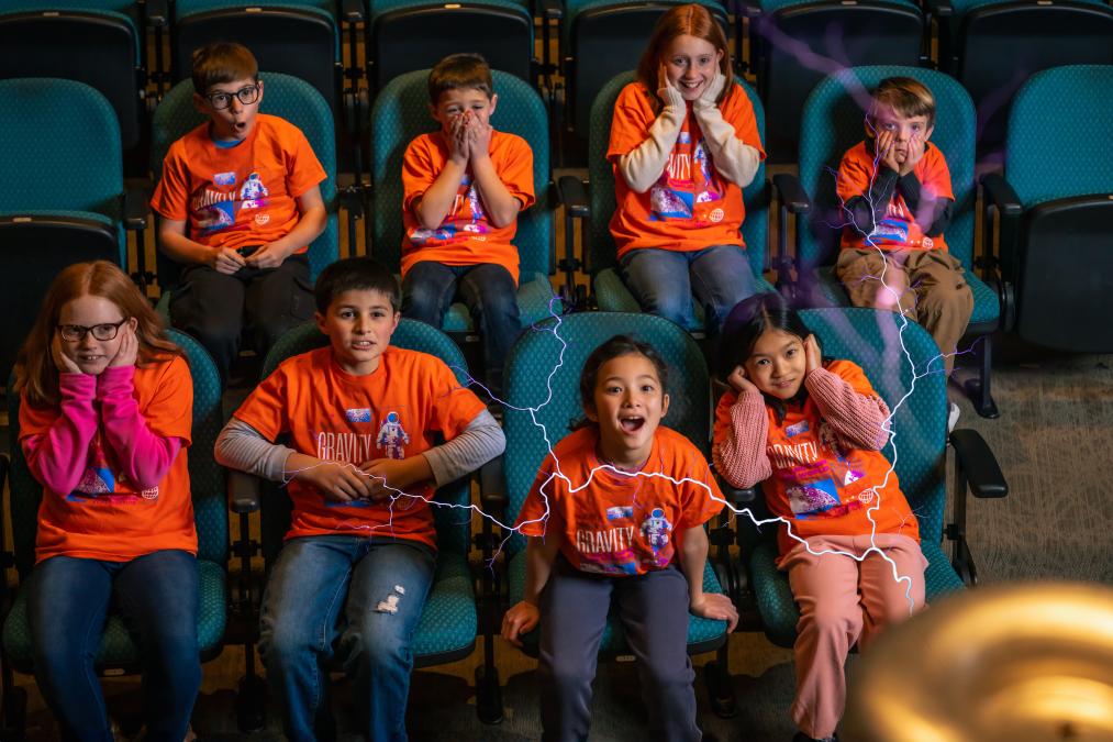 Kids in audience reacting to electricity demonstartion