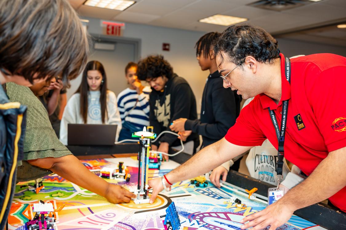 pacts students working around table