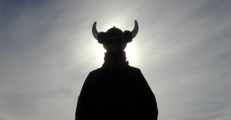 modern photo of individual wearing horned helmet